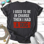 Dark t-shirt with "I Used To Be In Charge Then I Had A Dog" text.
