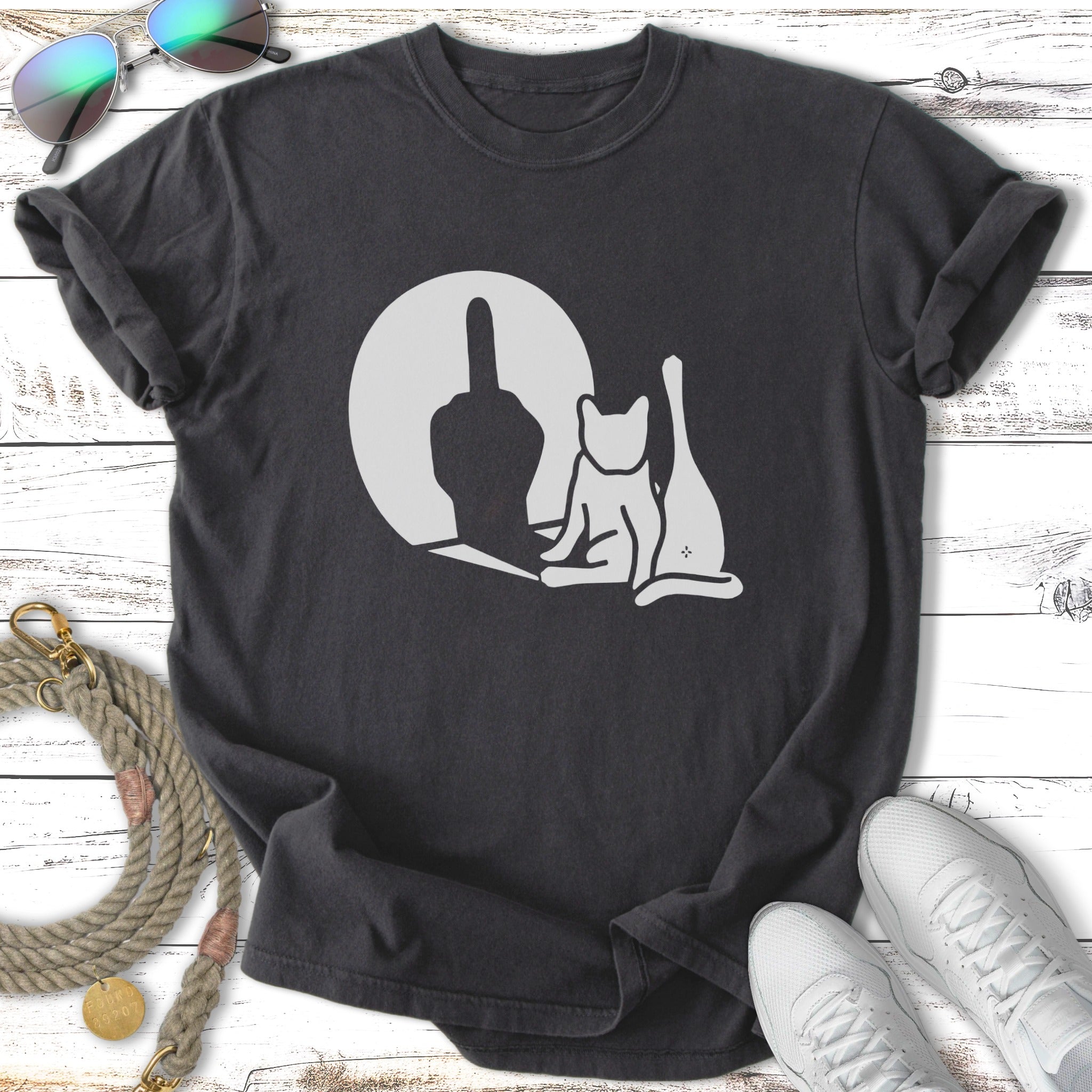 Dark t-shirt with a minimalist graphic of a cat and a middle finger silhouette.
