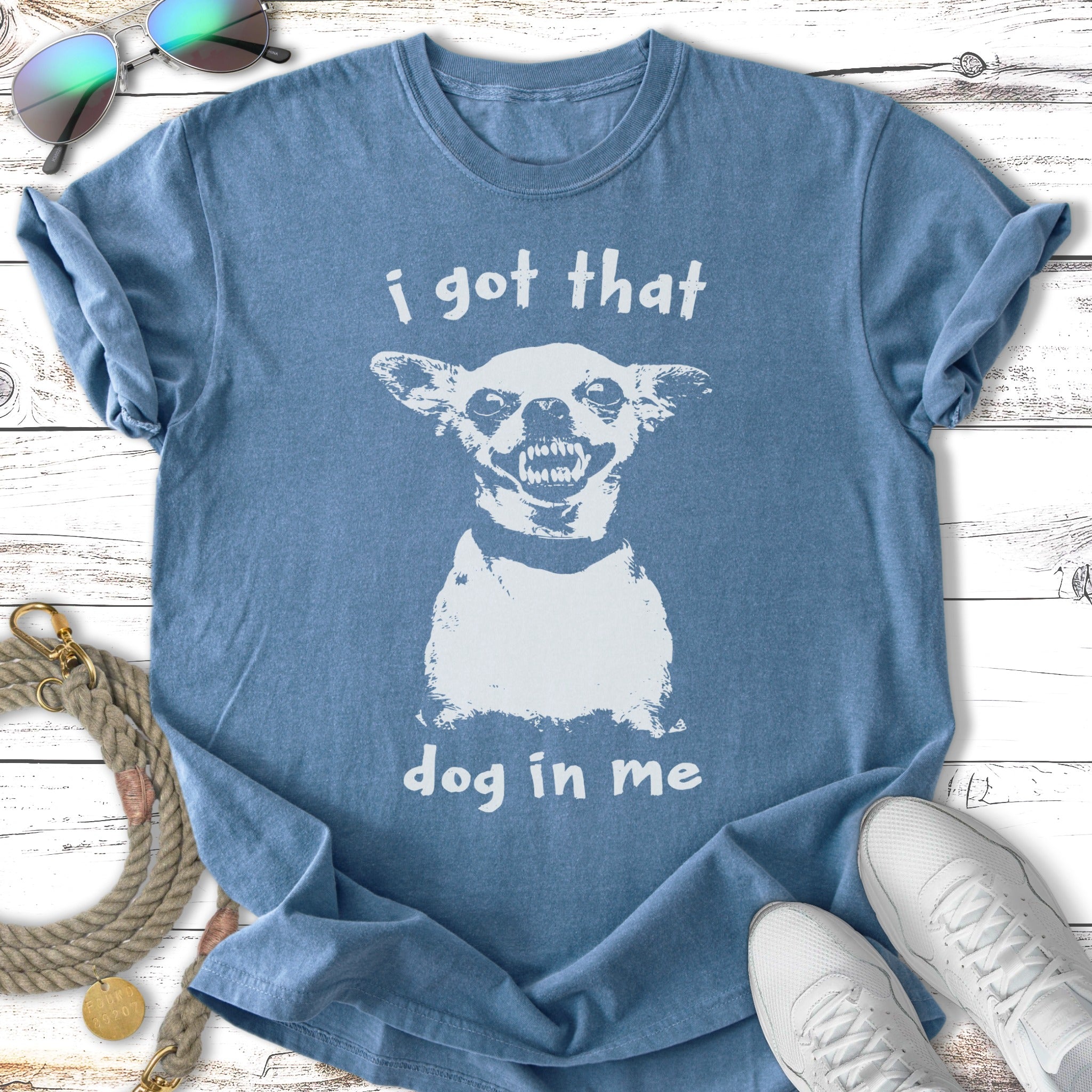 Blue t-shirt with white text and graphic of a snarling dog.