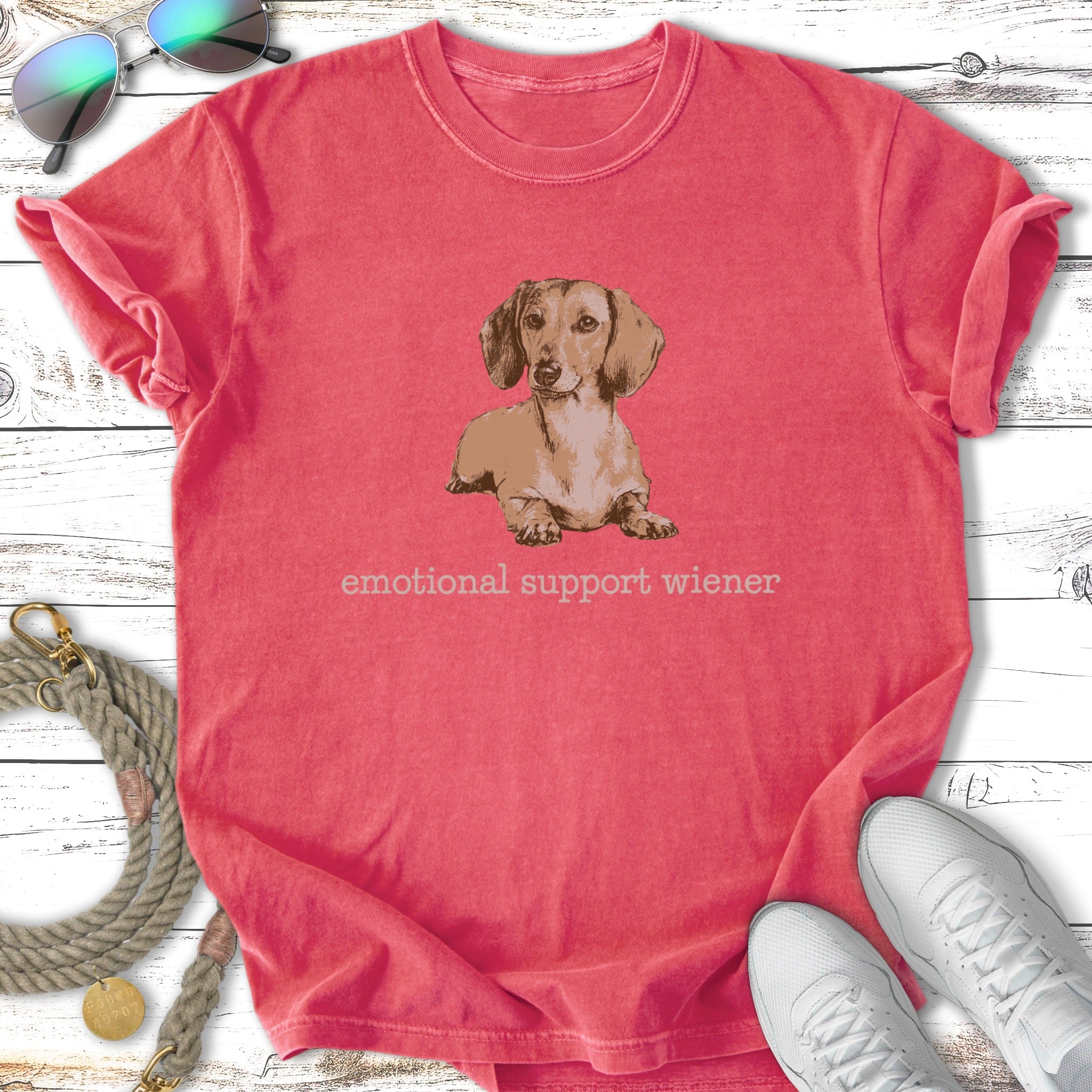 Coral t-shirt with a cartoon dachshund and "emotional support wiener" text.