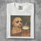 White t-shirt with a dog wearing sunglasses next to a beer.