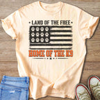 Peach t-shirt with American flag design featuring paw prints and text.