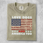 T-shirt with "LOVE DOGS AND AMERICA TOO" and paw prints on American flag.