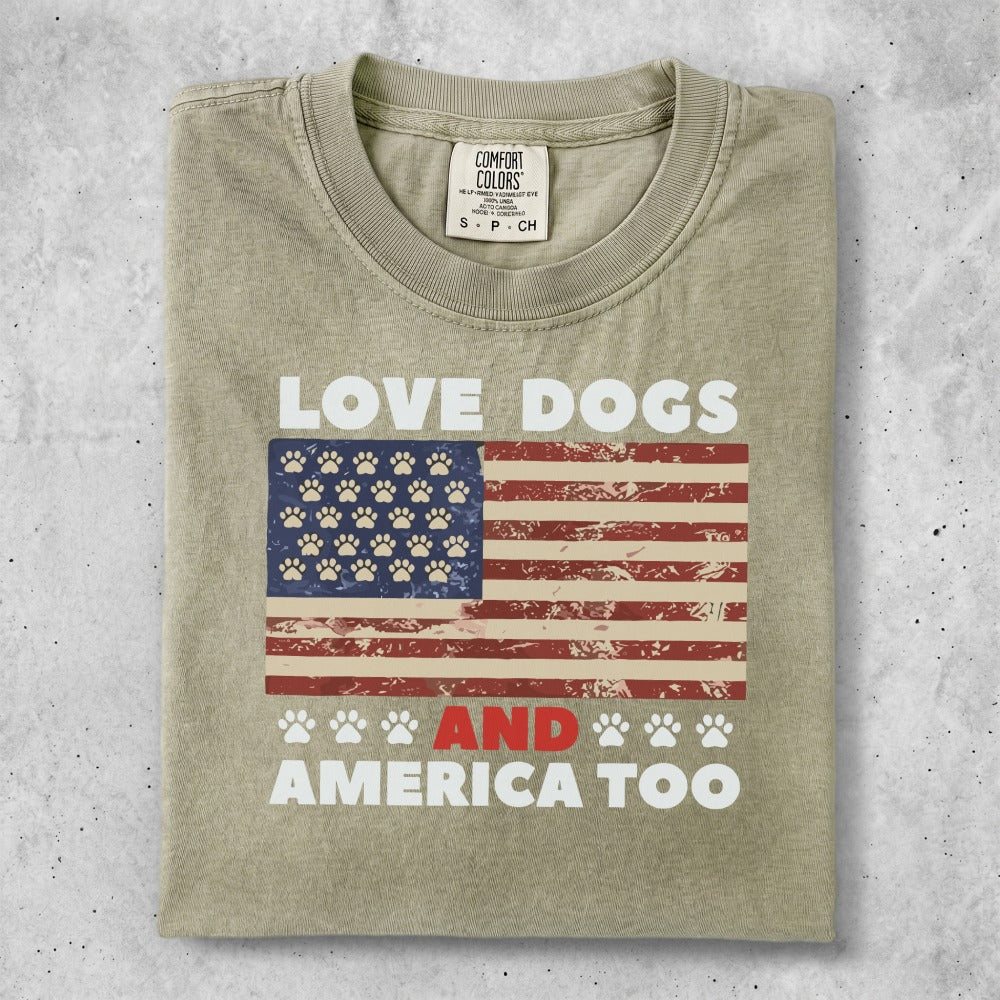 T-shirt with "LOVE DOGS AND AMERICA TOO" and paw prints on American flag.