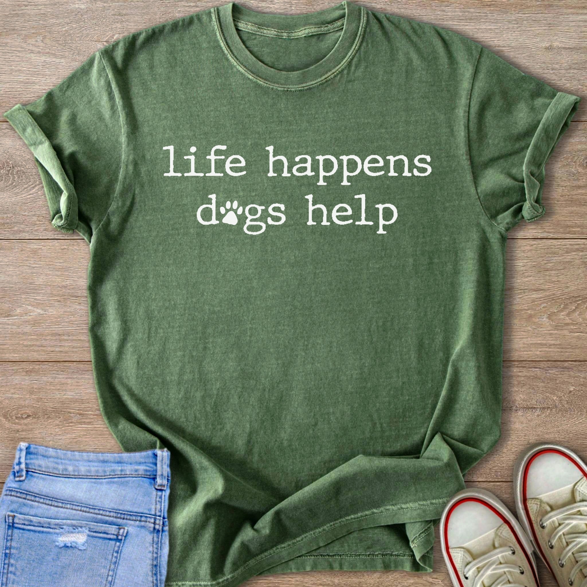 Green t-shirt with white text "life happens dogs help" and a paw print.