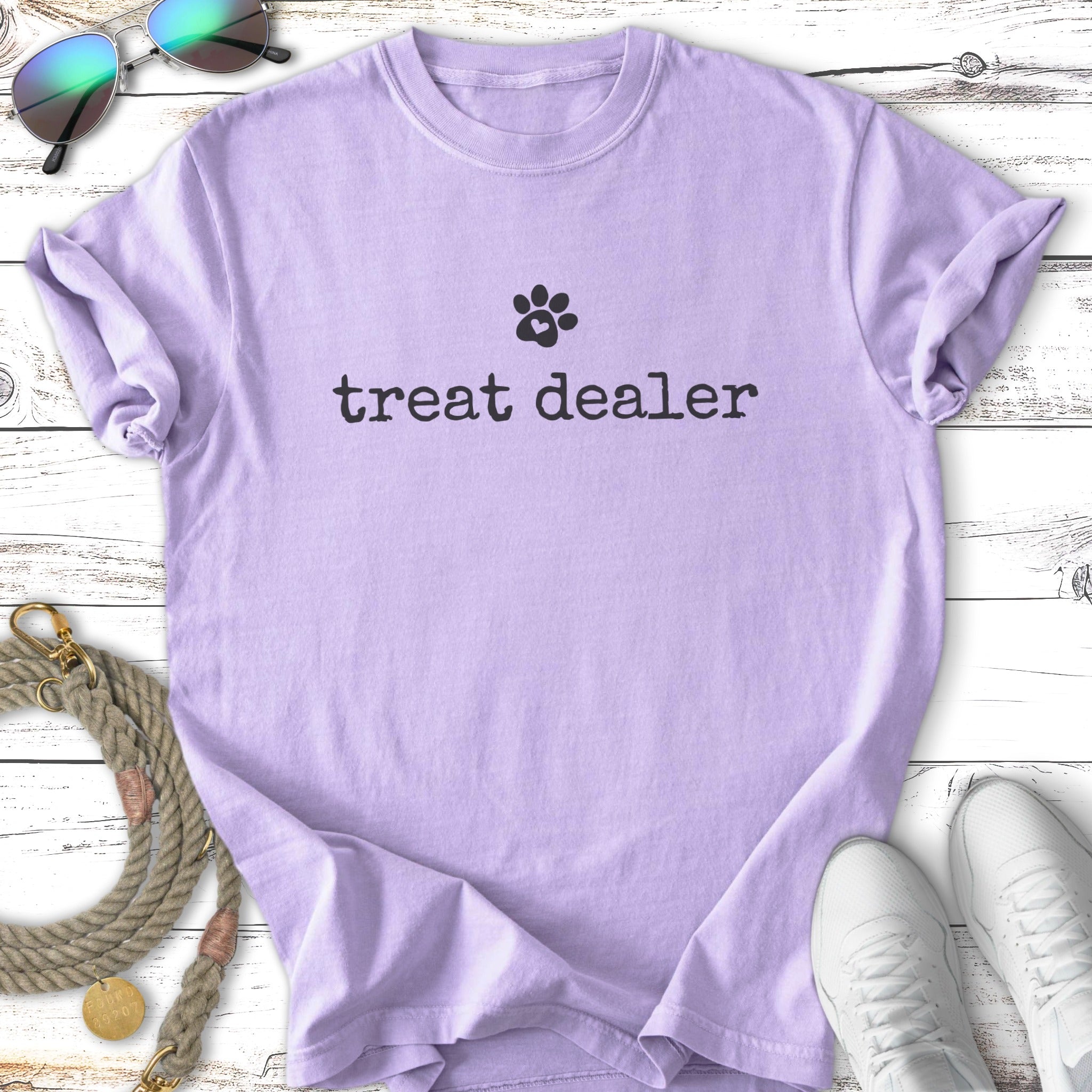 Lavender t-shirt with "treat dealer" and a paw print graphic.