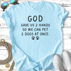 Light blue t-shirt with text "God gave us 2 hands so we can pet 2 dogs at once."