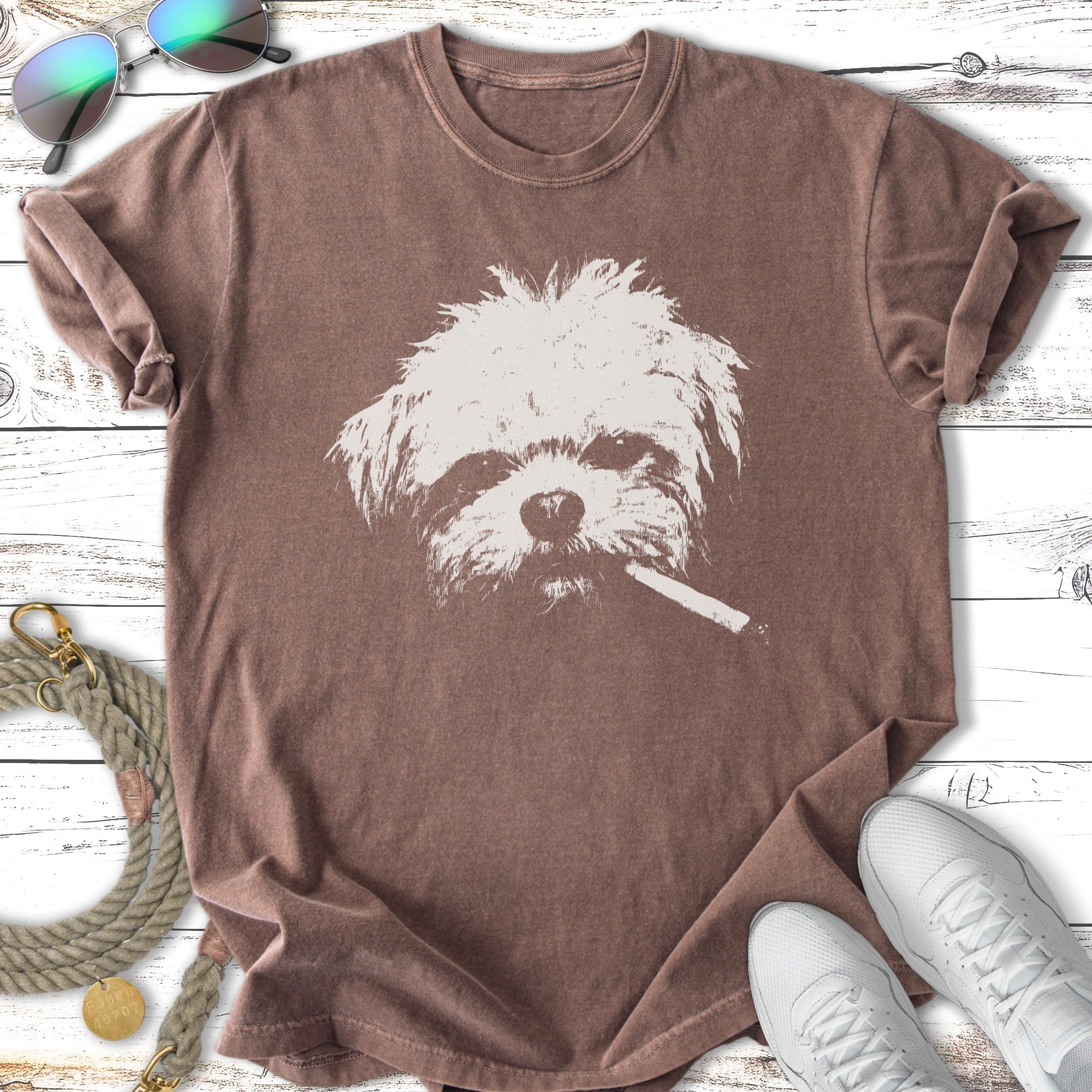 T-shirt with a white graphic of a shaggy dog's face smoking a cigarette.