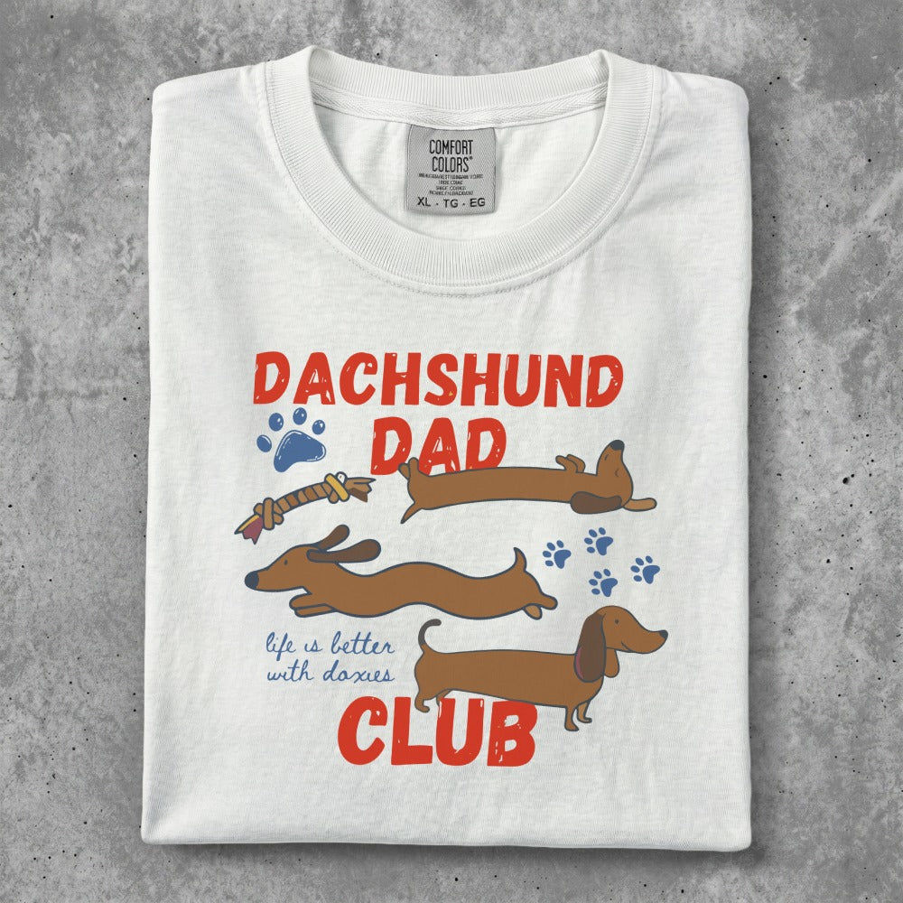 Dachshund Dad graphic tee with three dachshunds and text "life is better with doxies CLUB".