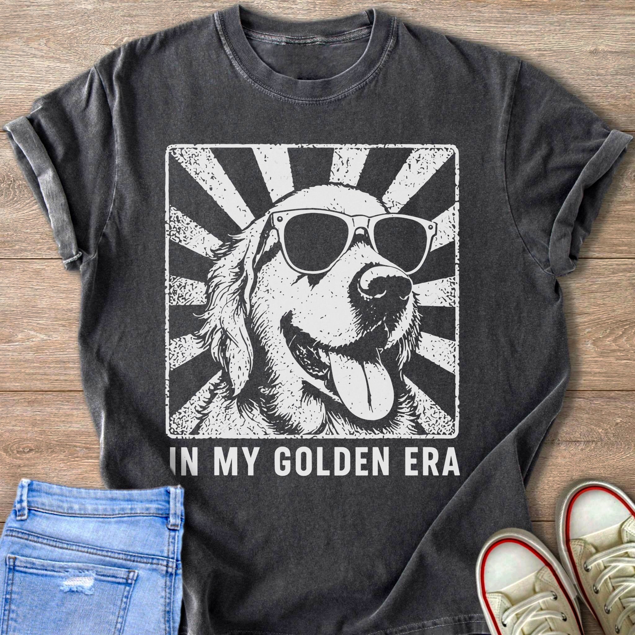 Dark grey t-shirt with a distressed graphic of a golden retriever wearing sunglasses and the text "IN MY GOLDEN ERA".