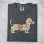 Dark gray t-shirt with a dachshund silhouette filled with floral pattern.