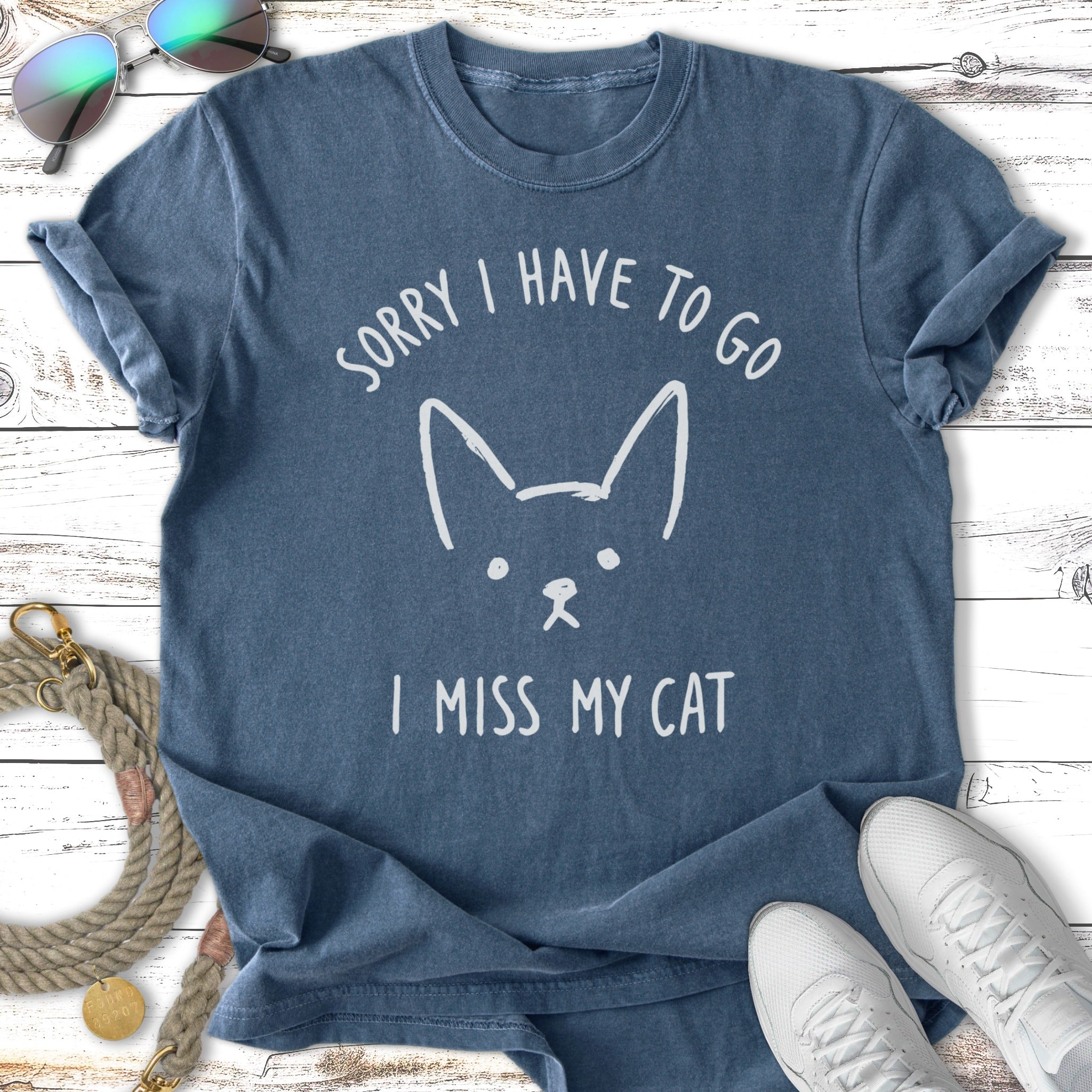 Navy t-shirt with a white cat illustration and text "Sorry I have to go I miss my cat".