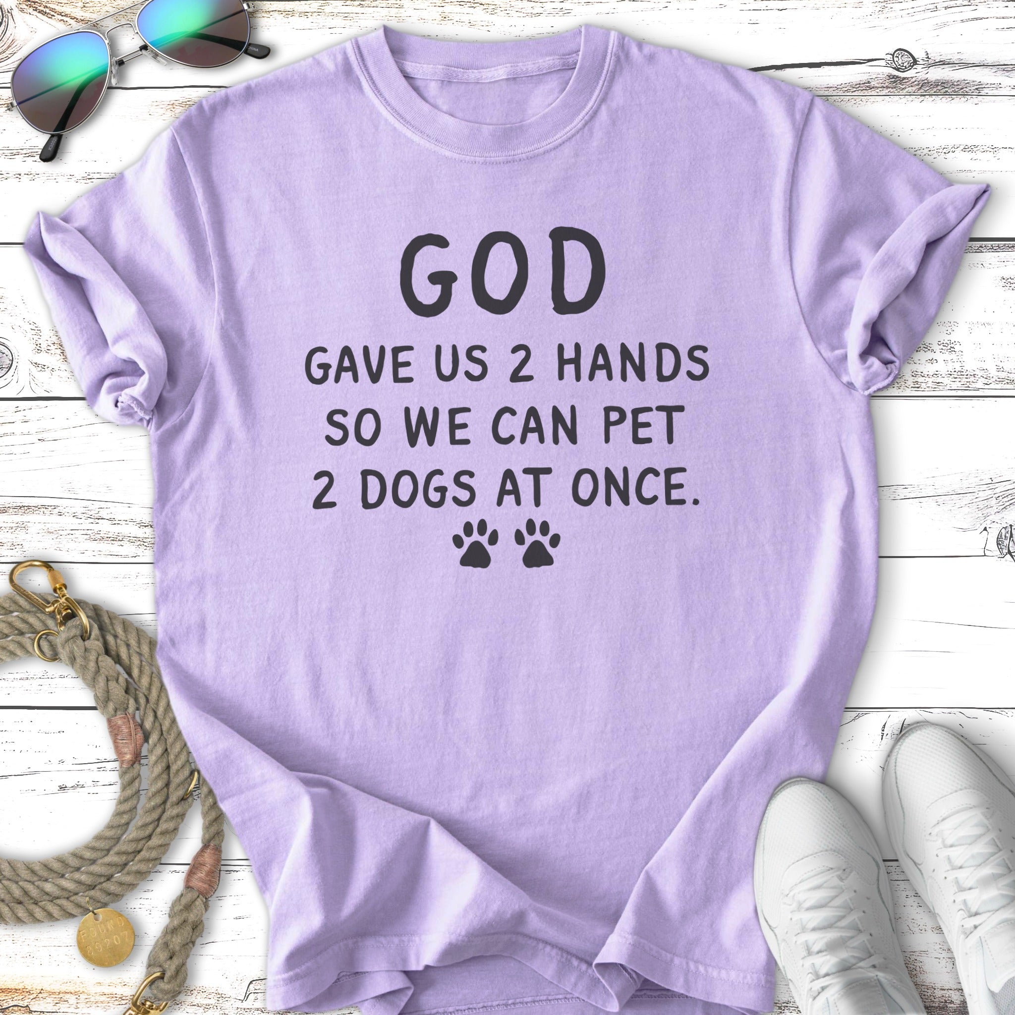 Lavender t-shirt with "God gave us 2 hands so we can pet 2 dogs at once."