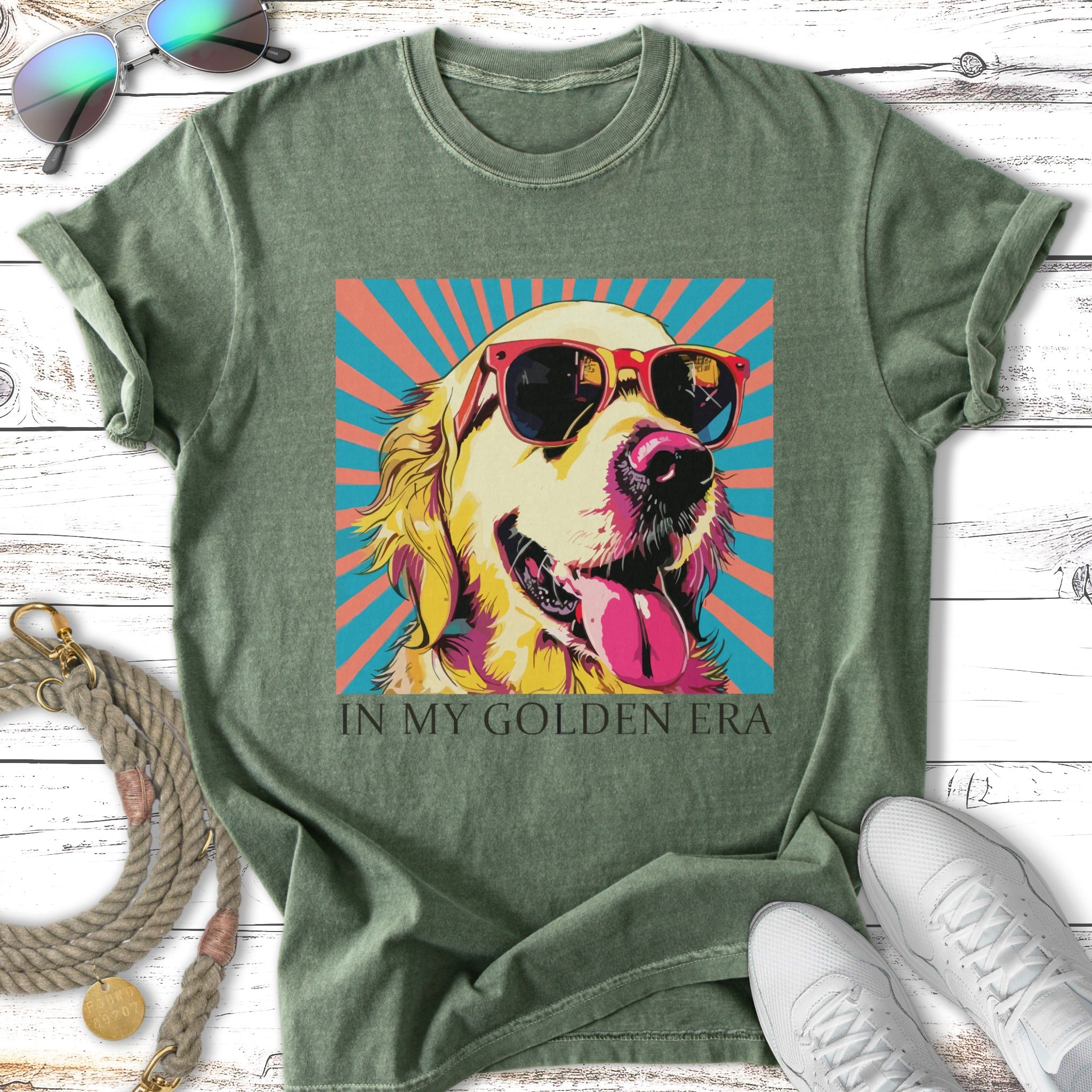 Golden retriever wearing sunglasses, "In My Golden Era" text on vintage t-shirt.