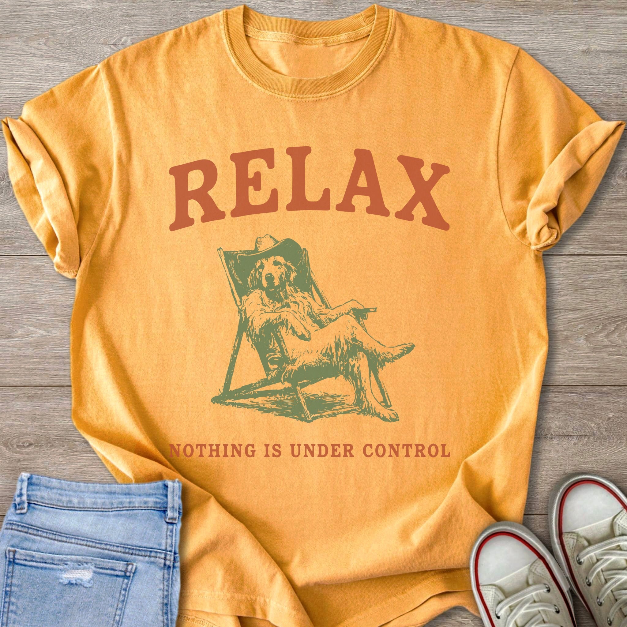 Orange t-shirt with "RELAX" and a dog in a lounge chair.