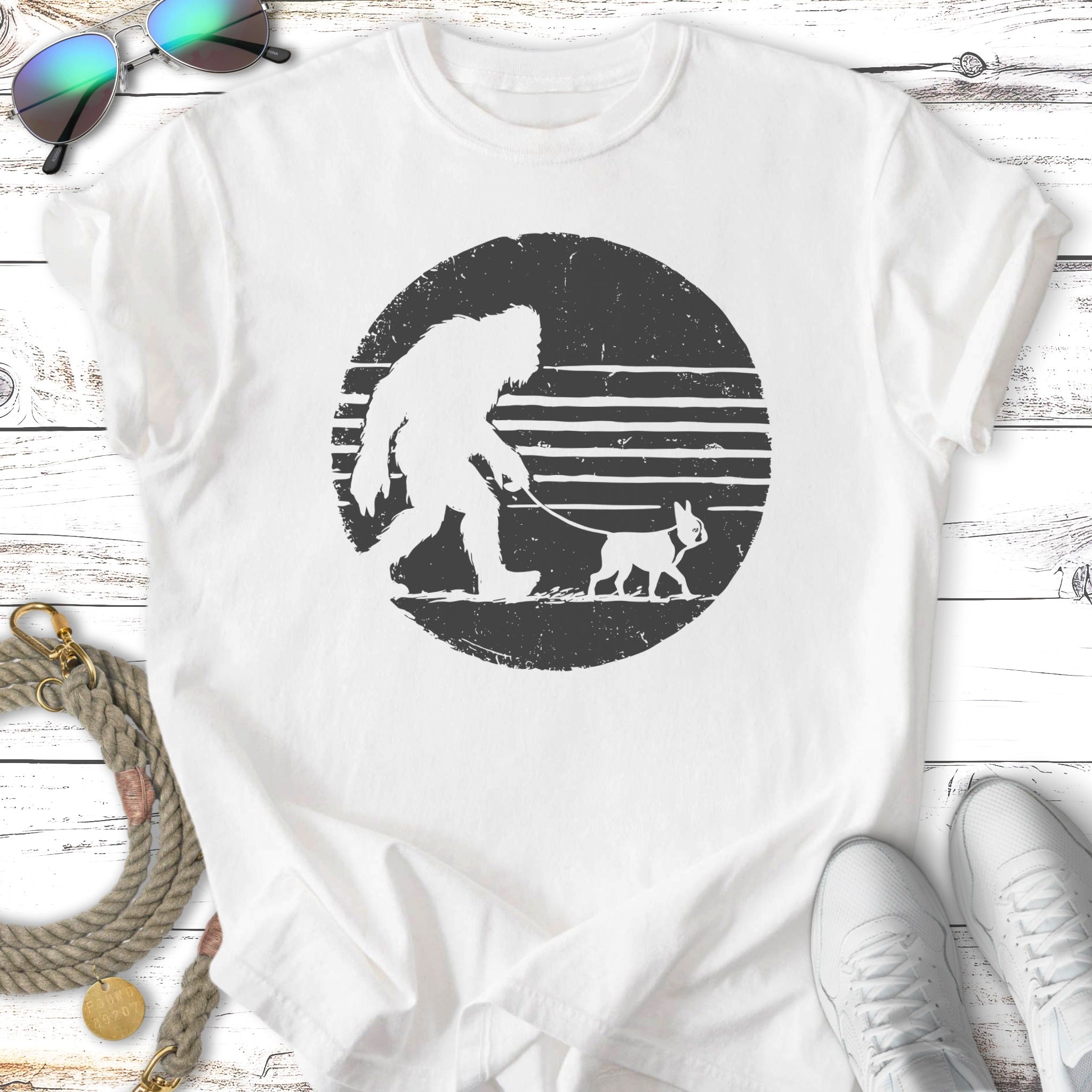 Bigfoot walking a French bulldog on a leash with striped circle background.