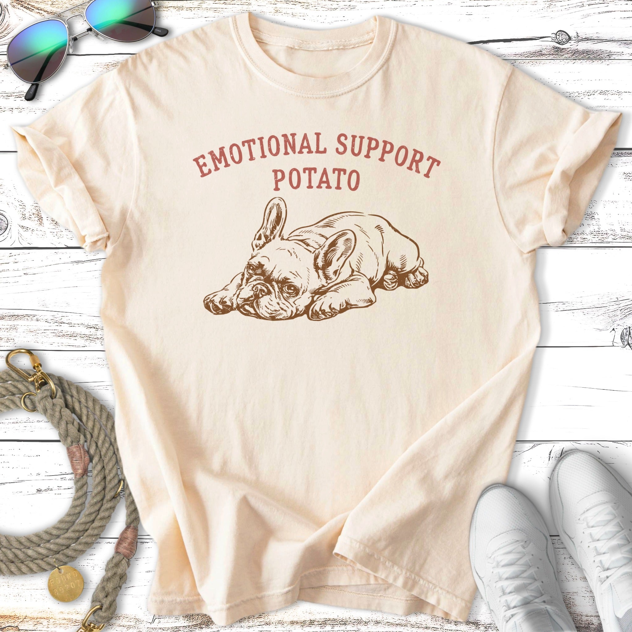 Cream t-shirt with "EMOTIONAL SUPPORT POTATO" text and French bulldog graphic.