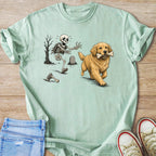 Golden retriever with bone chases skeleton in graveyard with bare tree.