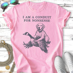 Pink t-shirt with a dog riding a goose, text reads "I AM A CONDUIT FOR NONSENSE".