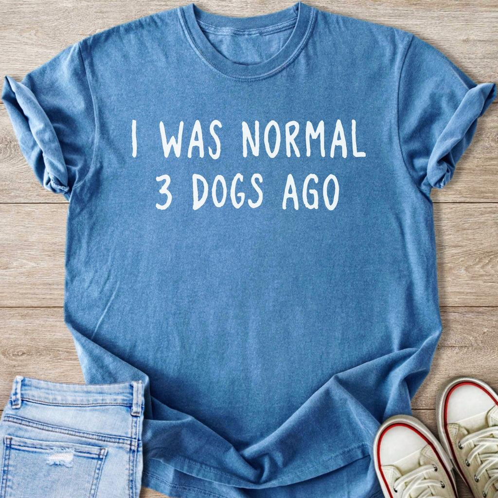 Blue t-shirt with white text "I WAS NORMAL 3 DOGS AGO"