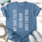 Blue t-shirt with white text "MY DOG TILTS HIS HEAD JUST LIKE YOU".