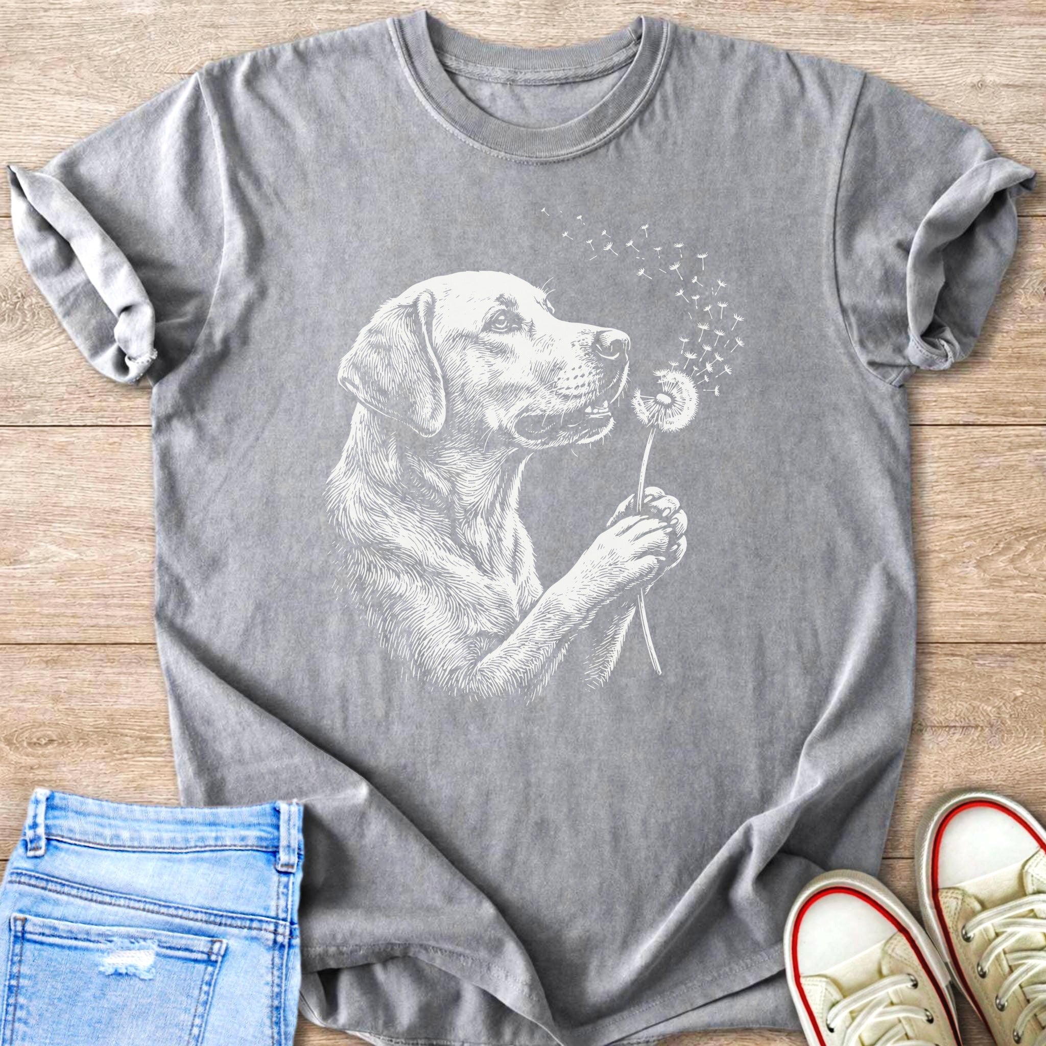 Grey t-shirt with white line drawing of a dog holding a dandelion.