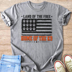 Gray t-shirt with distressed American flag featuring paw prints and text "HOME OF THE K9".