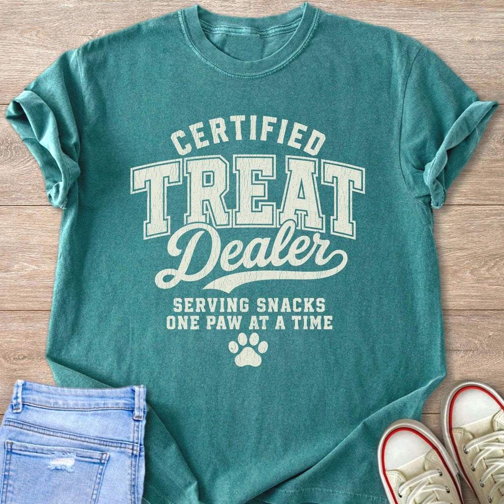 Teal t-shirt with text "Certified Treat Dealer Serving Snacks One Paw at a Time".
