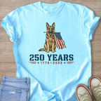 German Shepherd holding American flag with text "250 Years 1776-2026".