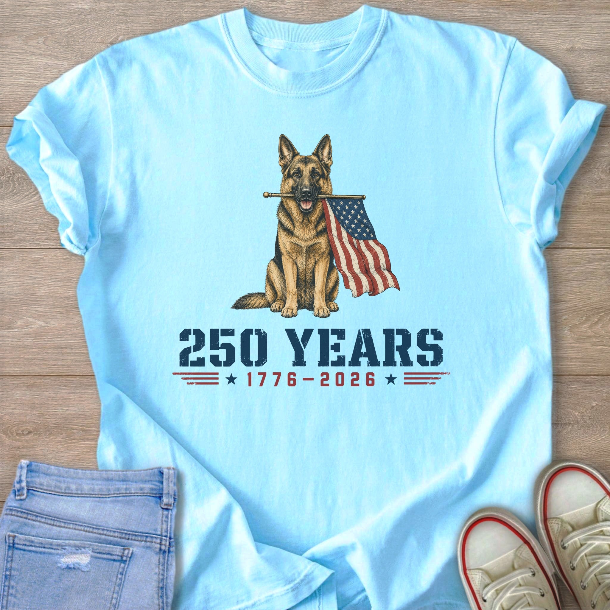 German Shepherd holding American flag with text "250 Years 1776-2026".