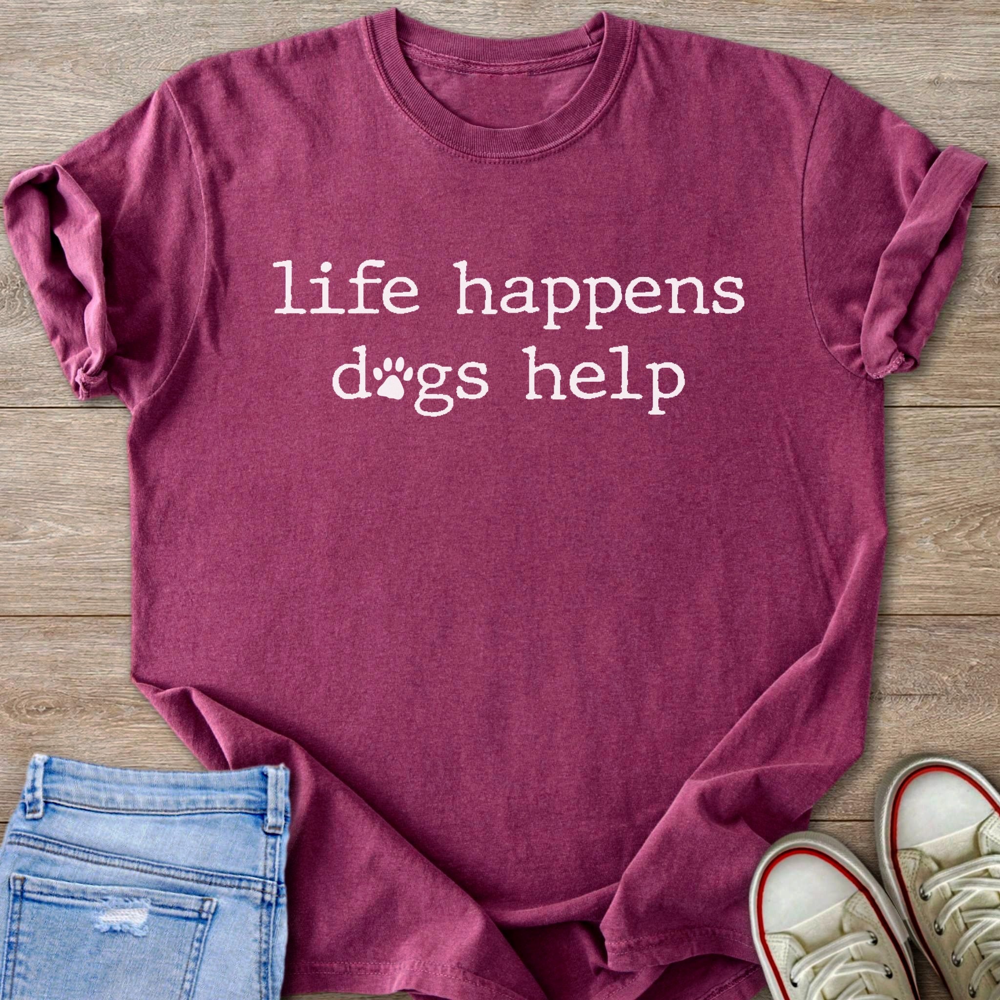 Burgundy t-shirt with "life happens dogs help" written in white text.