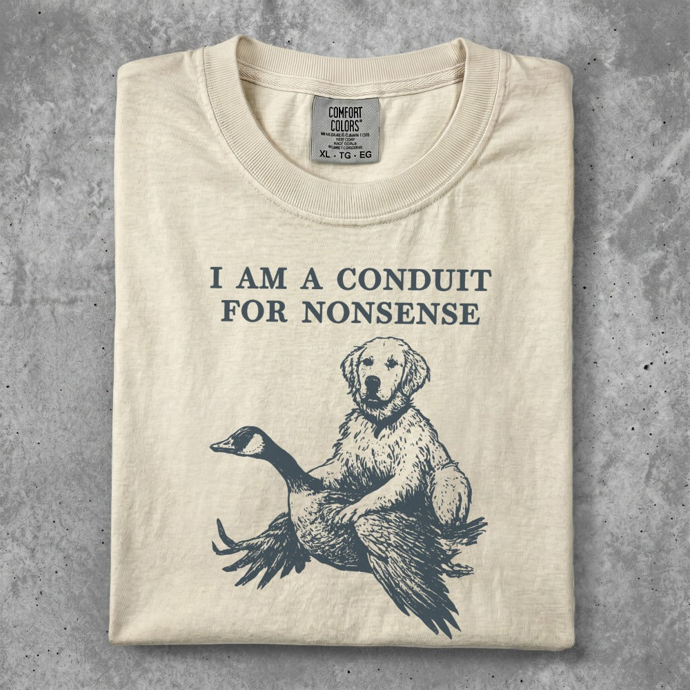 Dog and goose illustration on a cream t-shirt reading "I am a conduit for nonsense."