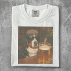 Bernese Mountain Dog wearing sunglasses and a cap, drinking beer.