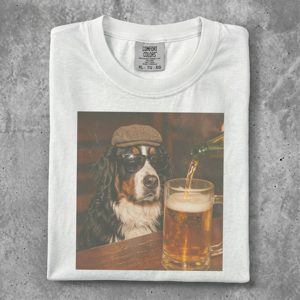 Bernese Mountain Dog wearing sunglasses and a cap, drinking beer.