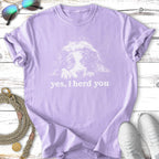 Lavender t-shirt with a white line drawing of a dog and text "yes, I herd you".