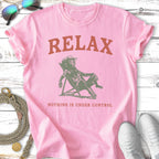 Pink t-shirt with distressed "RELAX" and "NOTHING IS UNDER CONTROL" text.