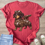Dachshund in steampunk gear on a red t-shirt, with jeans and sneakers.