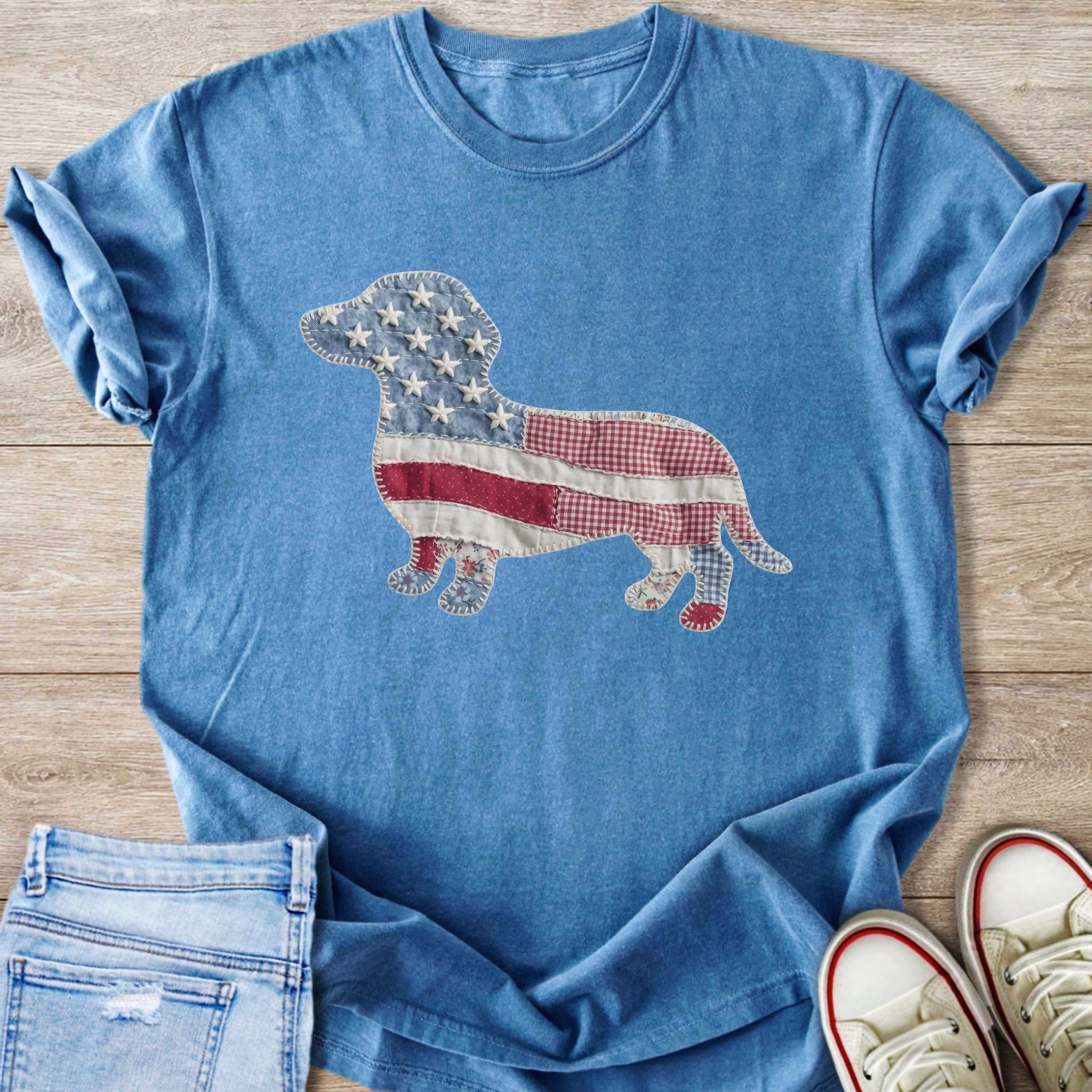 Blue t-shirt with a patchwork US flag dachshund graphic.