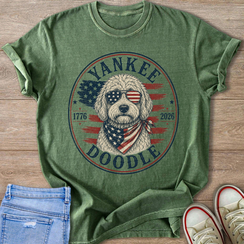 Green t-shirt with a doodle wearing sunglasses and bandana, "Yankee Doodle" text.