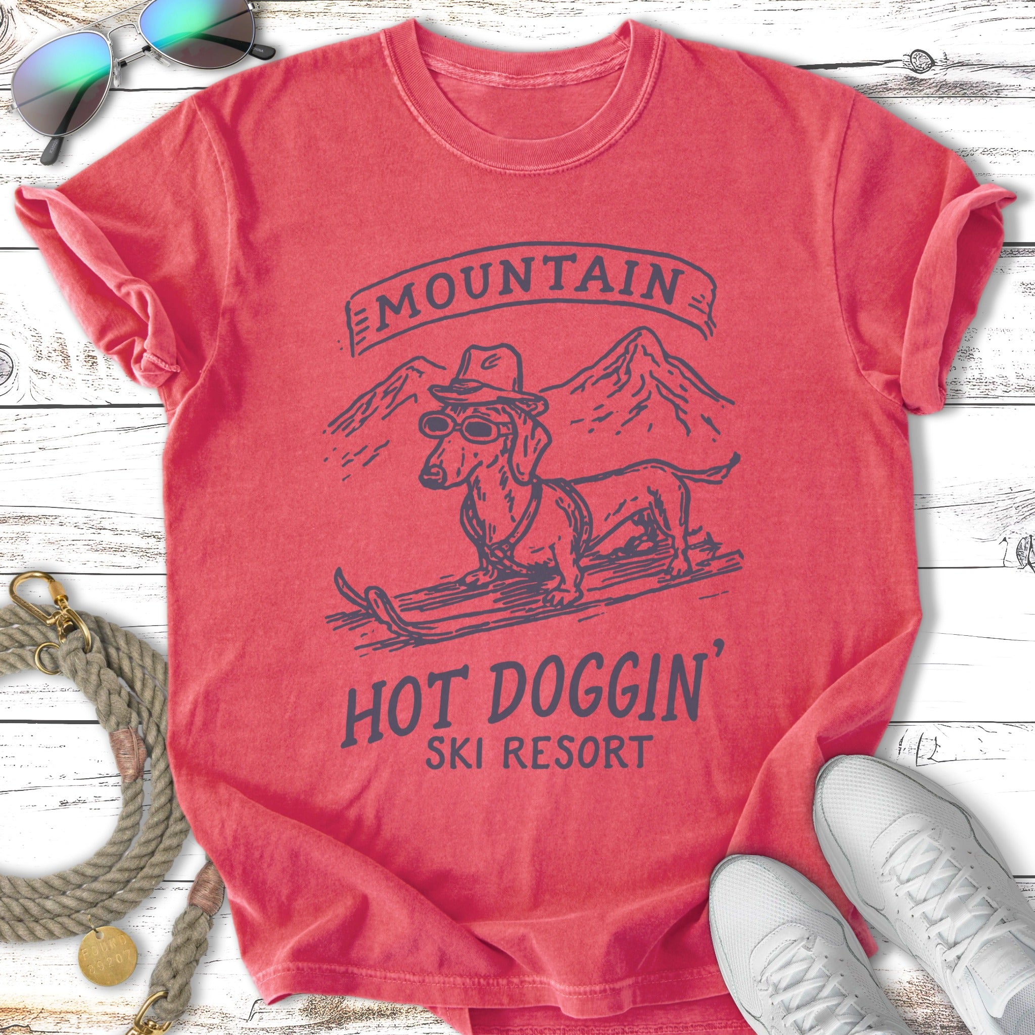 T-shirt graphic featuring a dachshund in sunglasses skiing at Mountain Hot Doggin' Ski Resort.