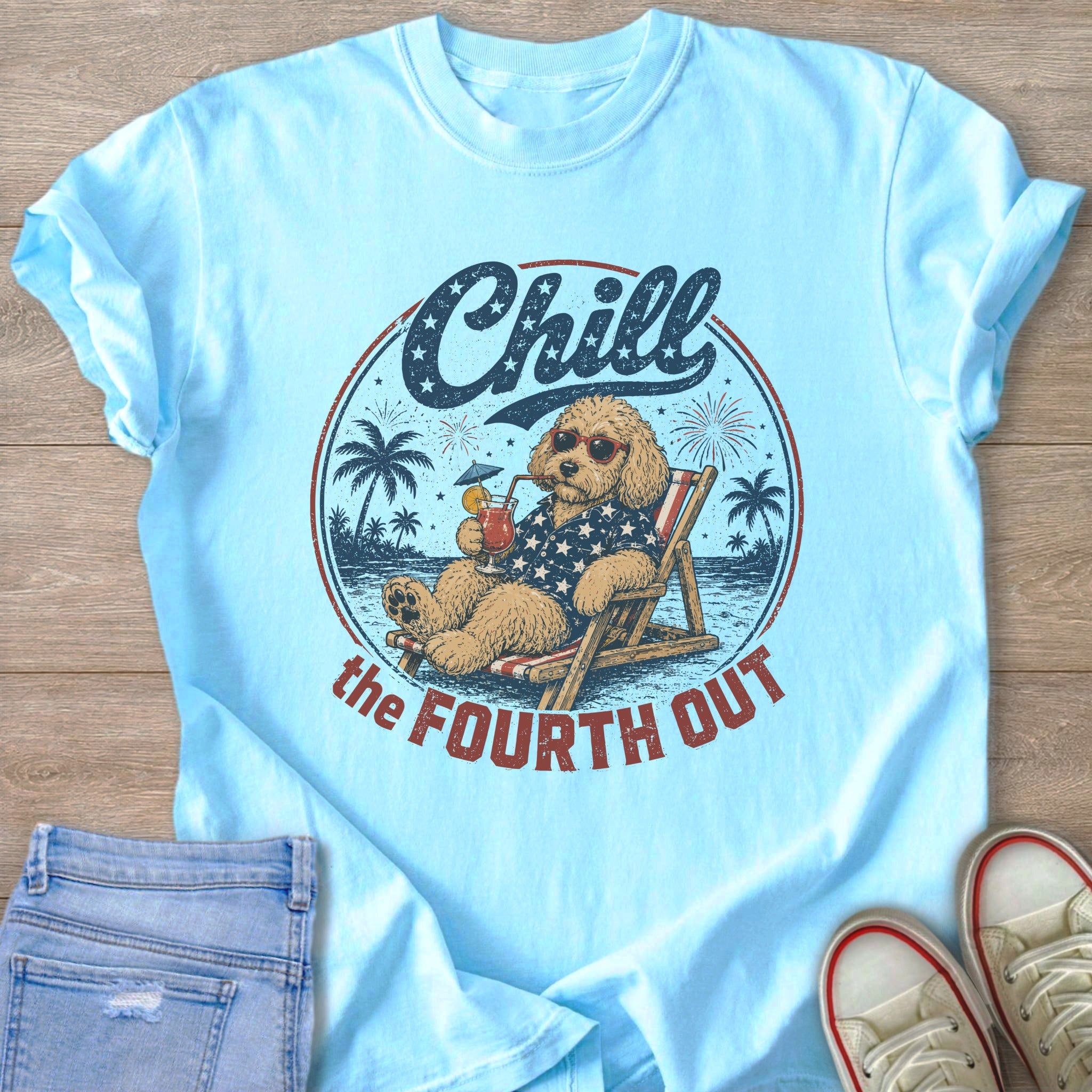 Light blue t-shirt with graphic of dog saying "Chill the Fourth Out"