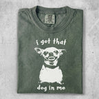Green t-shirt with a graphic of a dog's head and the text "i got that dog in me".