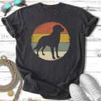 Black t-shirt with vintage golden retriever silhouette on striped sunset graphic.