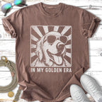 T-shirt featuring a vintage-style graphic of a golden retriever wearing sunglasses.