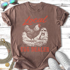 Chicken and kitten graphic on brown t-shirt, "Local Egg Dealer" text.