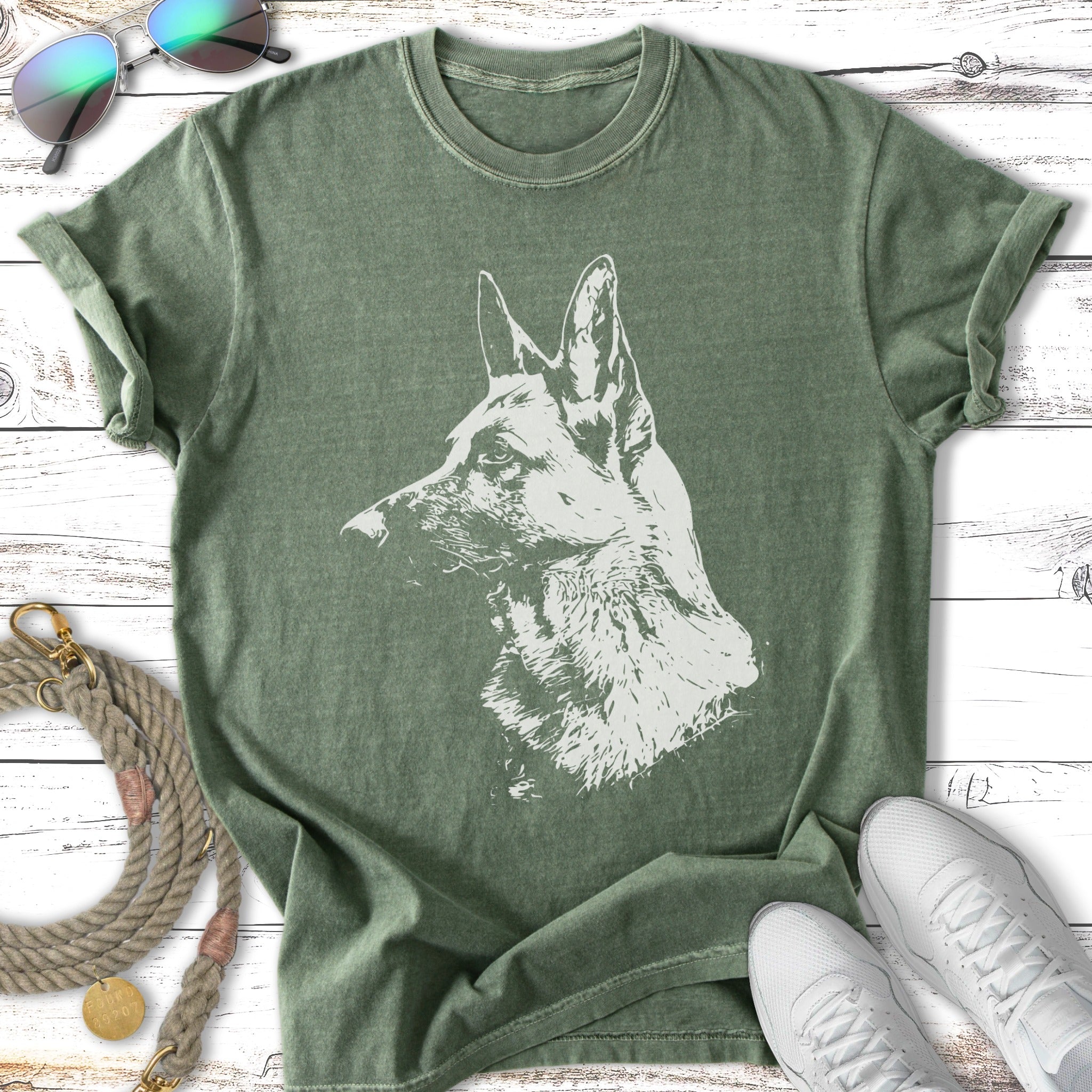 Green t-shirt with a white graphic of a German Shepherd's head in profile.