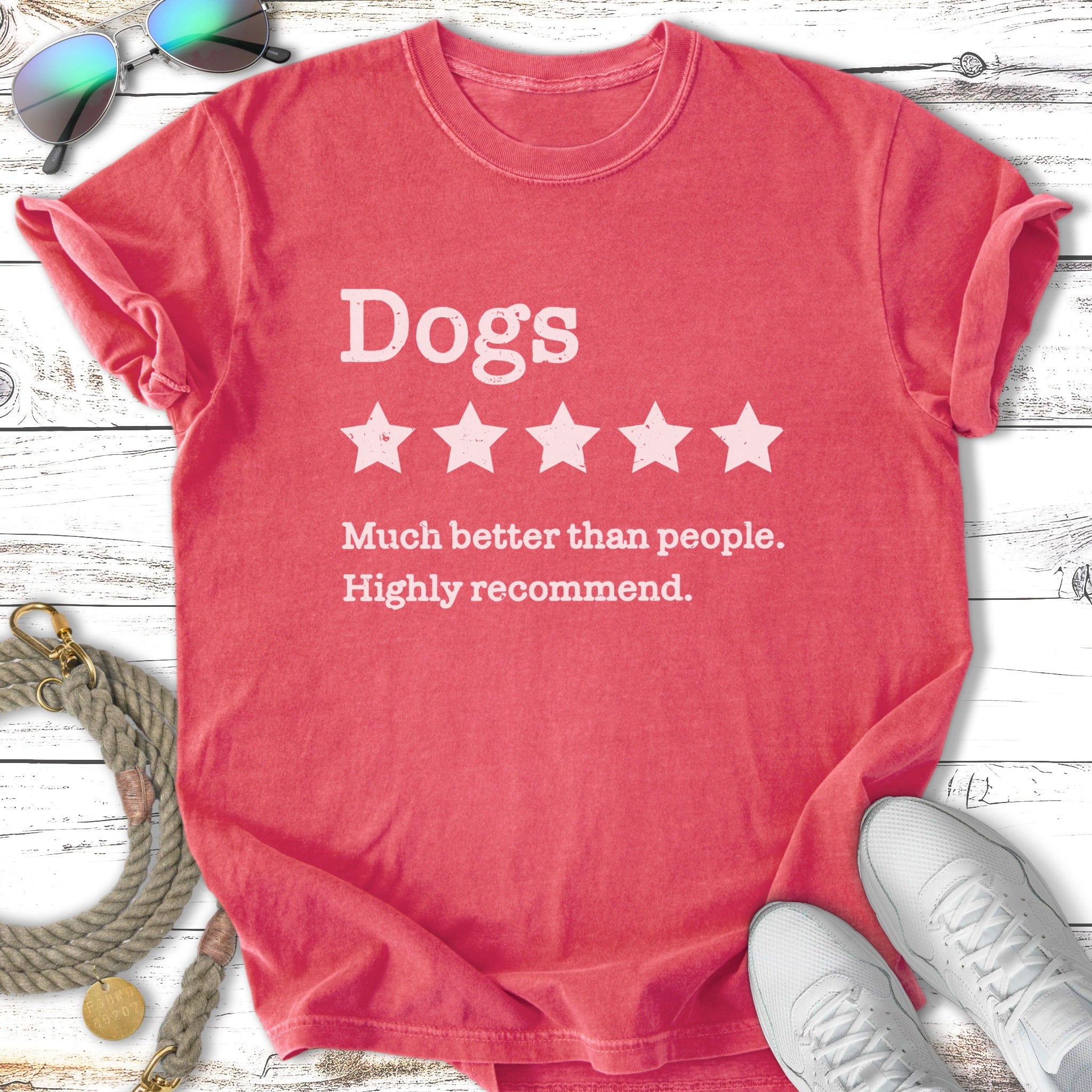 Coral t-shirt with white text "Dogs, 5 stars, Much better than people. Highly recommend."