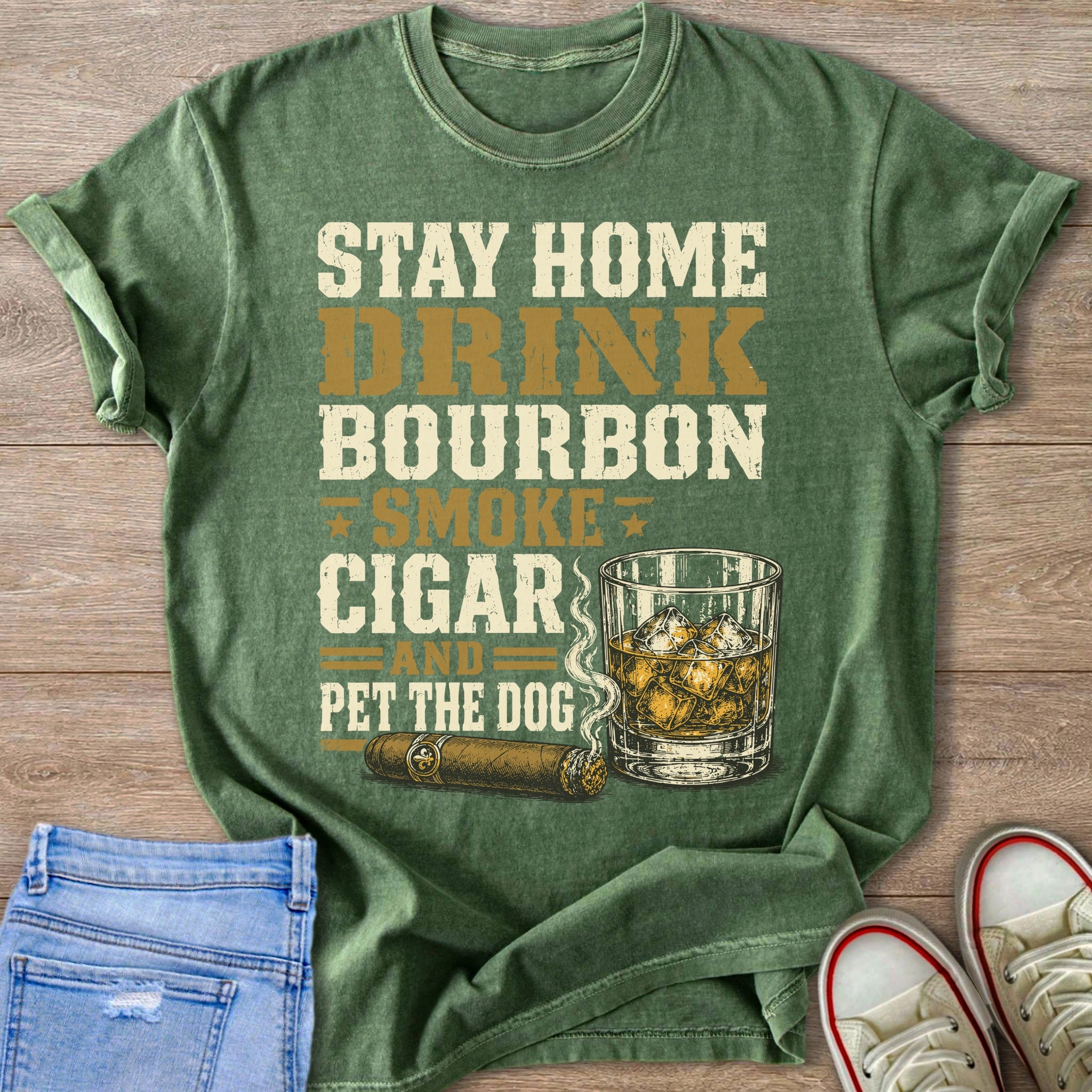 Green t-shirt with "Stay Home Drink Bourbon Smoke Cigar And Pet The Dog" text and illustrations.
