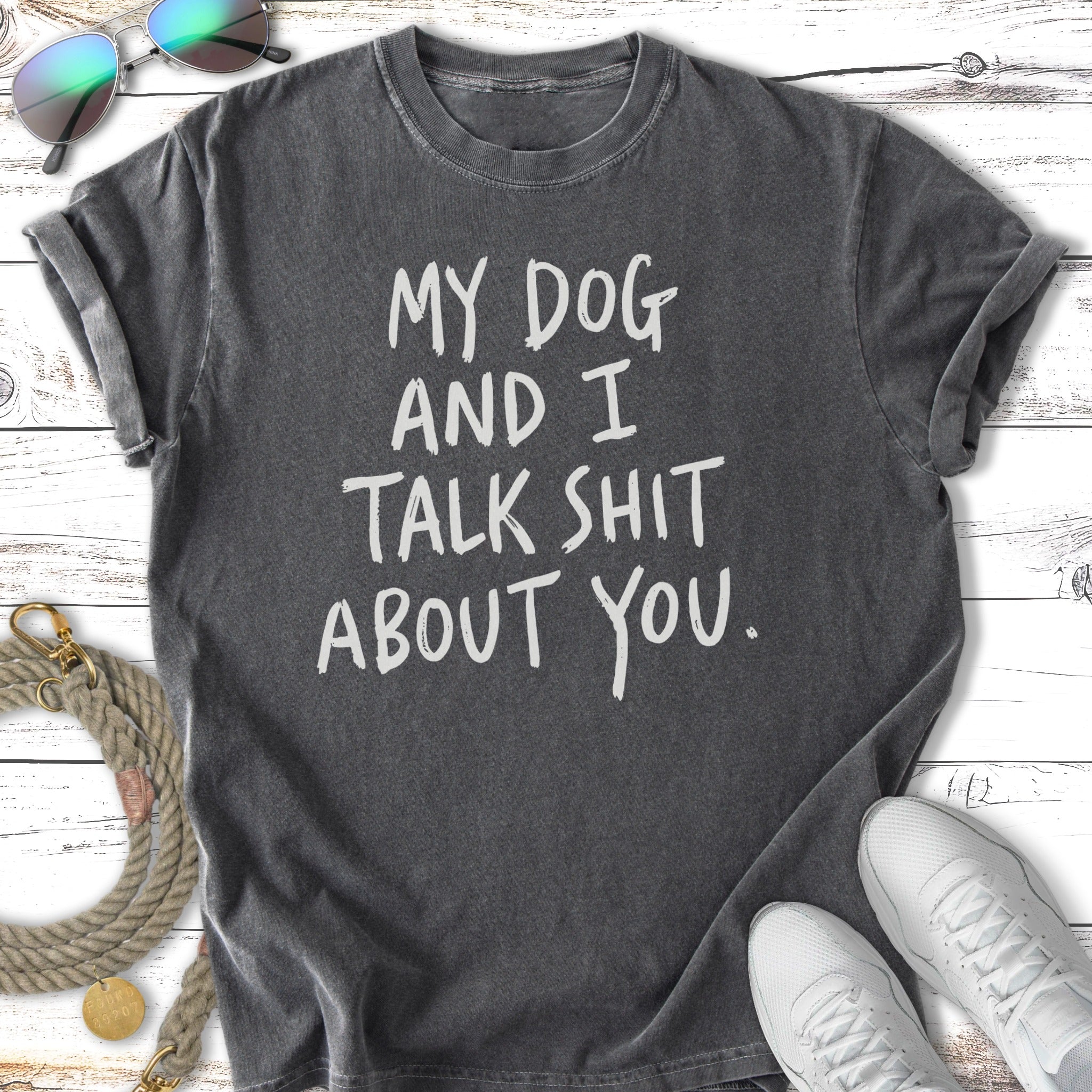 Dark gray t-shirt with white text reading "My dog and I talk shit about you."