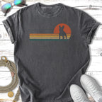 French bulldog silhouette against a retro sunset stripe design on a dark t-shirt.
